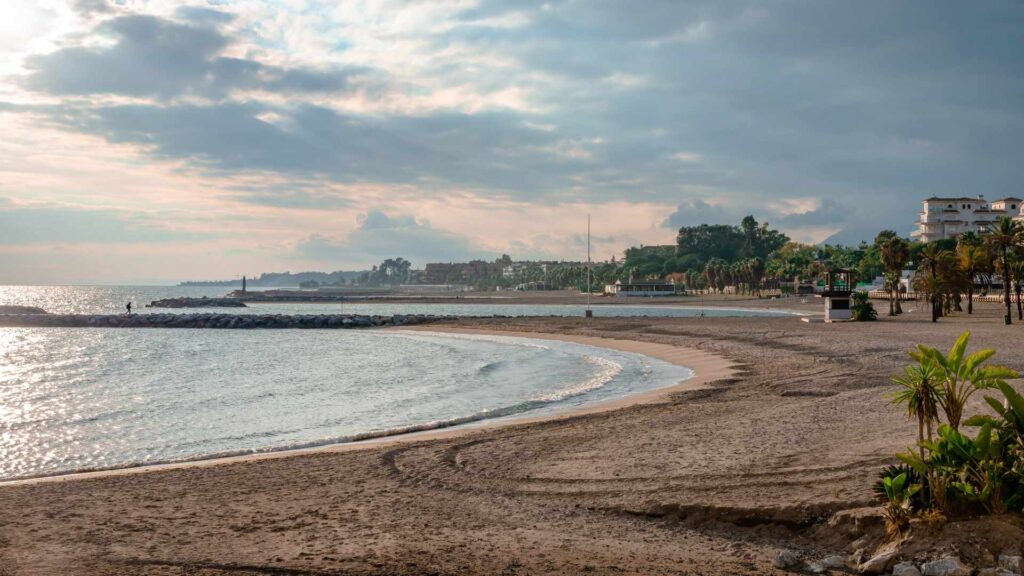 Scenic beachfront in Nueva Andalucia, Spain, near Modern Apartments for Sale in Nueva Andalucia, showcasing sea views and a relaxed coastal living appeal, ideal for Nueva Andalucia property investment.