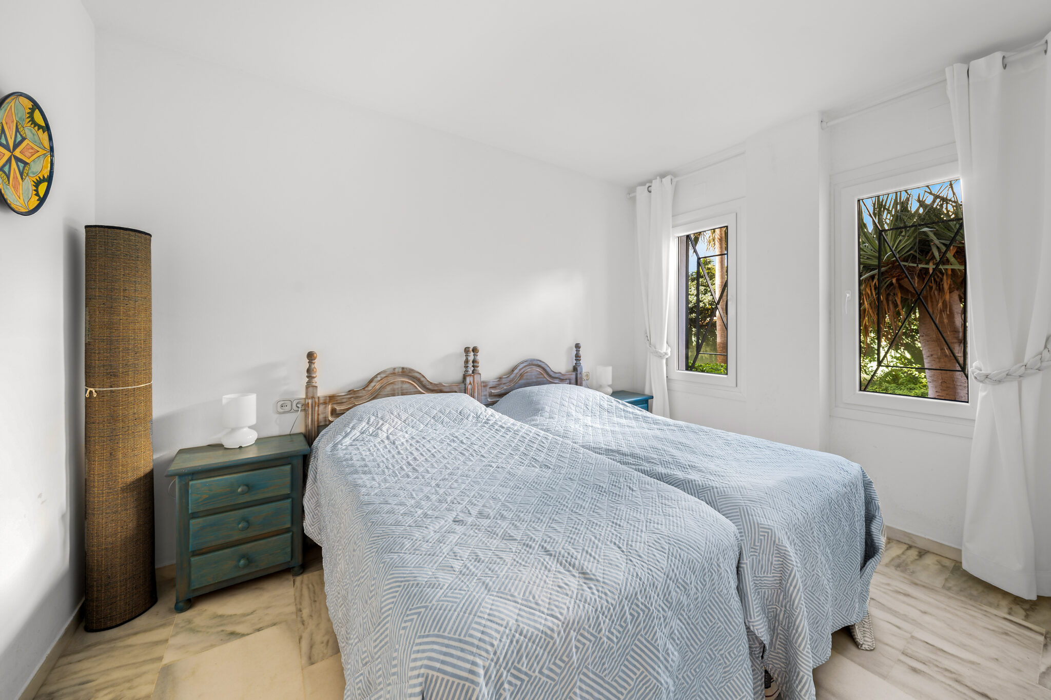 Bright guest bedroom with garden views in Estepona apartment