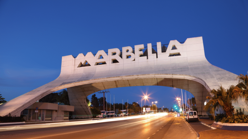 Marbella welcome arch at night, iconic entrance to the city.
