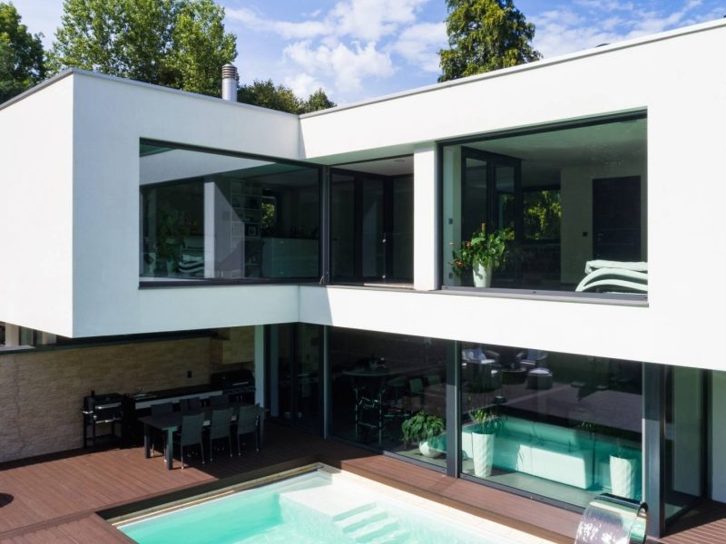 Modern luxury villa with private pool for sale in Estepona, Spain, featuring contemporary architecture and large glass windows — ideal for buyers searching for luxury villas Estepona is known for.